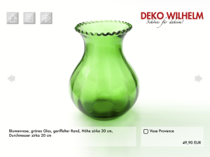 Grüne, bauchige Glasvase in einem Muster-Onlineshop